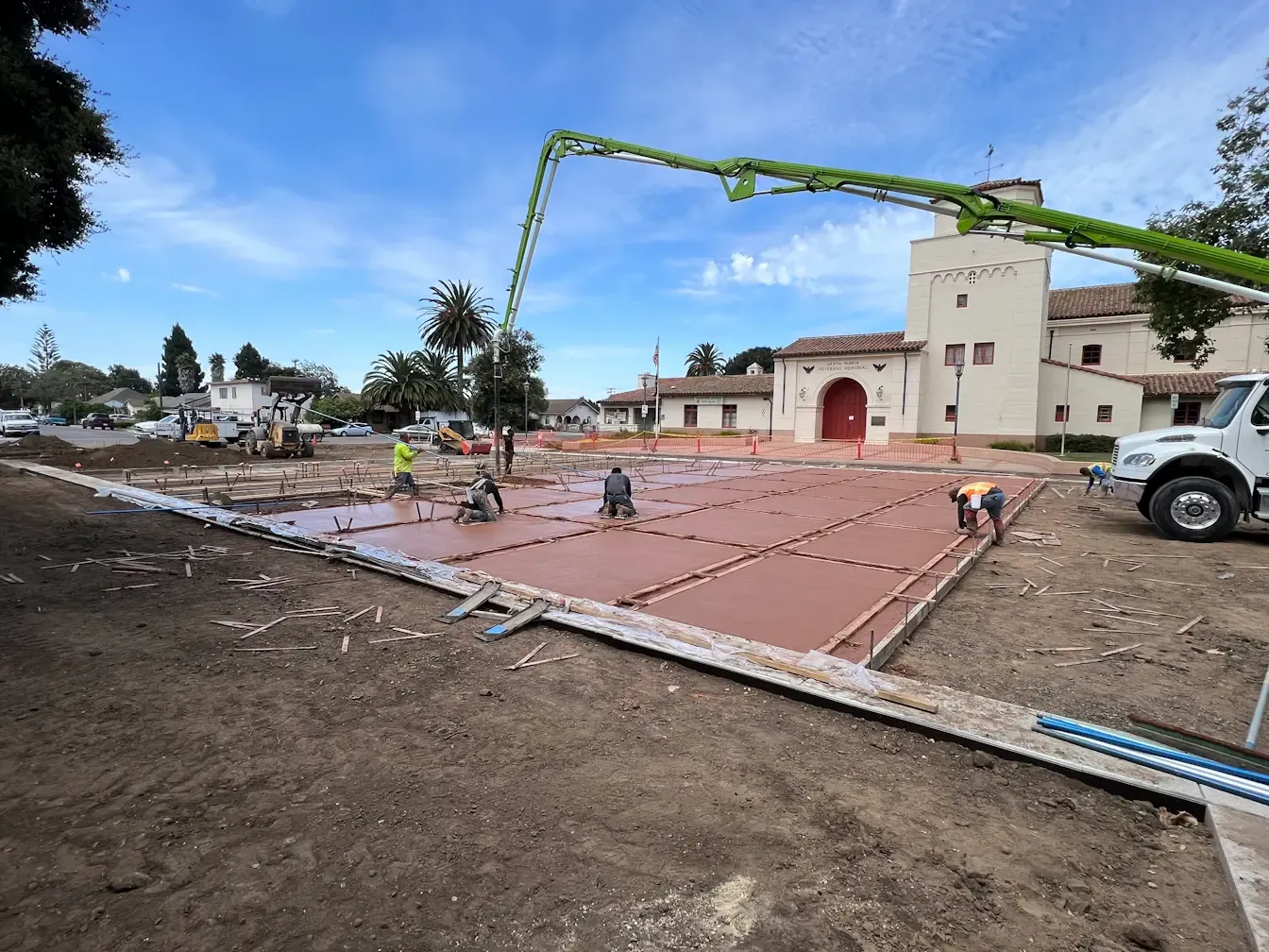 Concrete pump truck pouring concrete at a construction project site in Santa Maria, CA