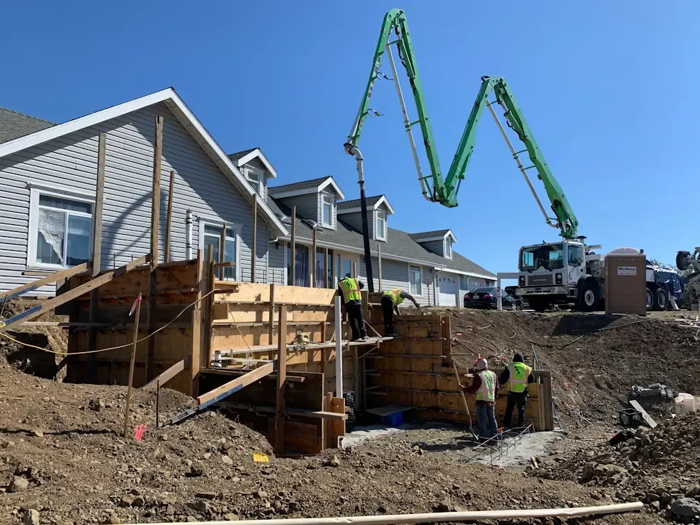 Concrete retaining wall installation for residential foundation addition in Atascadero, CA